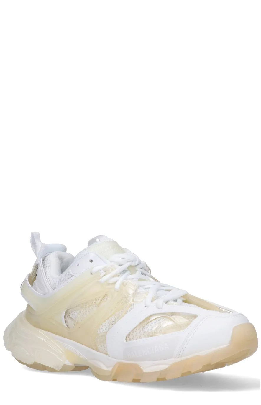 A pair of white Balenciaga Track Clear Sole sneakers with double tongue design and logo details.