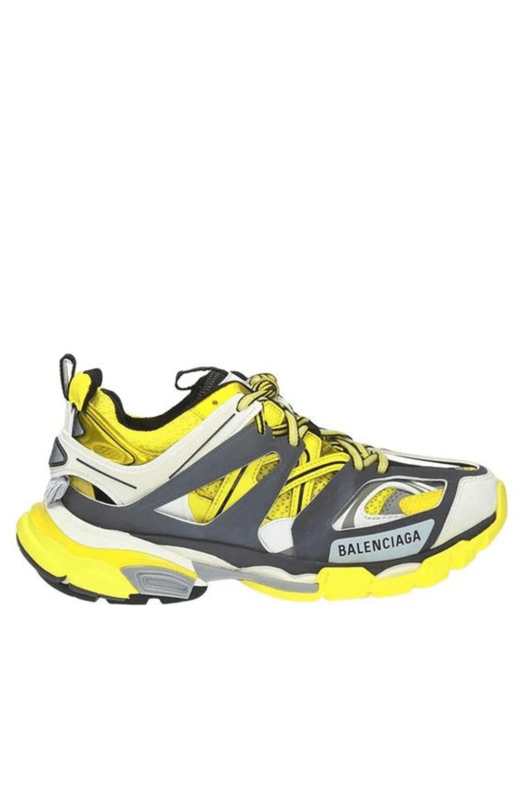 A pair of Balenciaga track sneakers in yellow, black, and white colors, with a thick white sole and yellow accents.