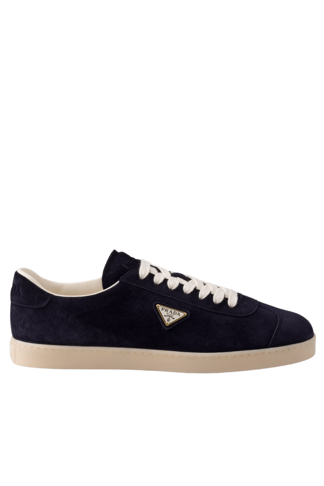 A navy blue Prada suede low-top sneaker with white laces and the brand's triangular metal logo on the side.