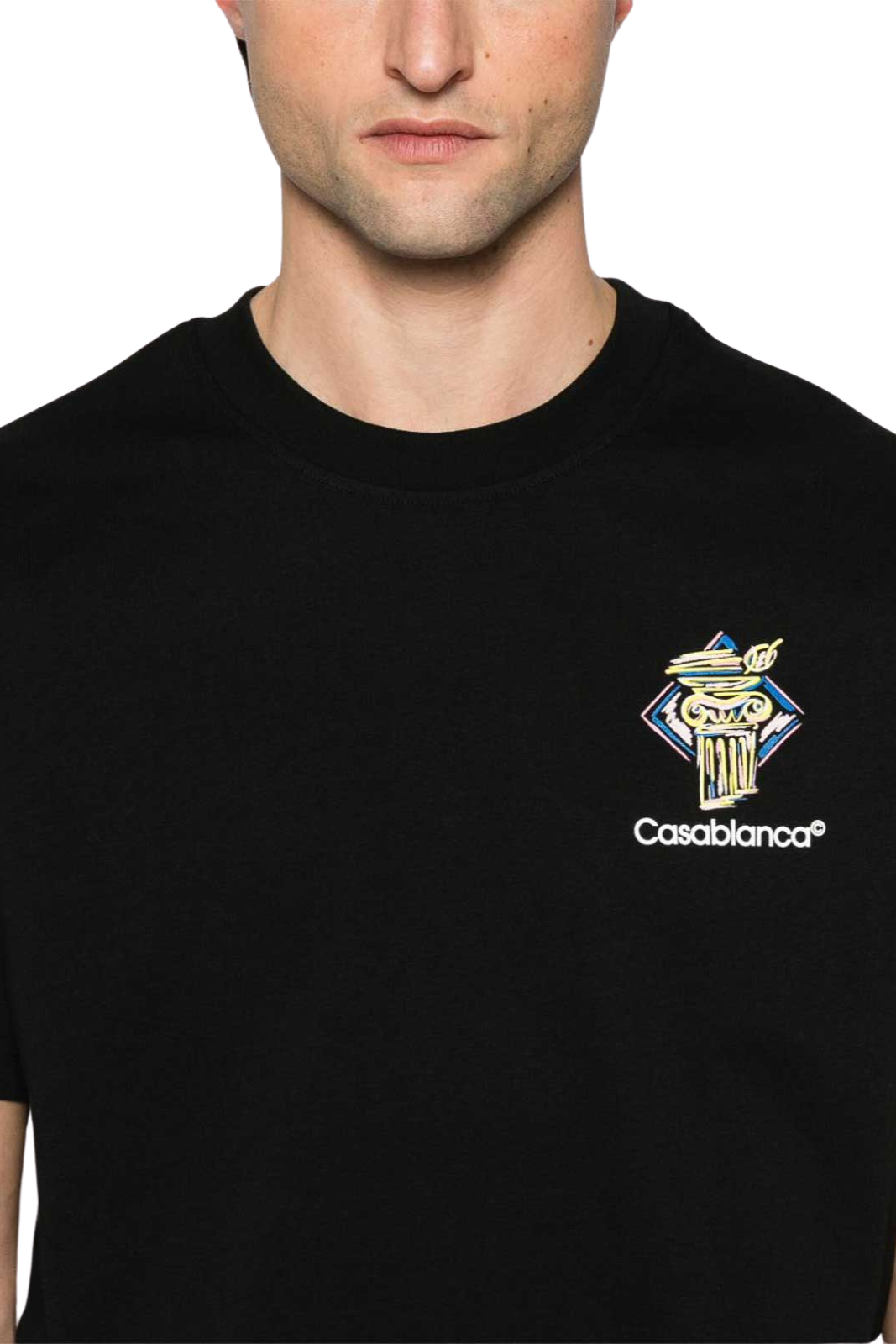 Black t-shirt with Casablanca logo worn by a person
