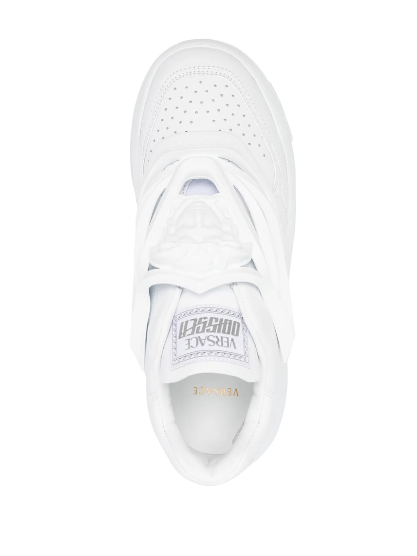 A pair of white low-top Versace Odissea sneakers with a full white color scheme and a logo on the heel.