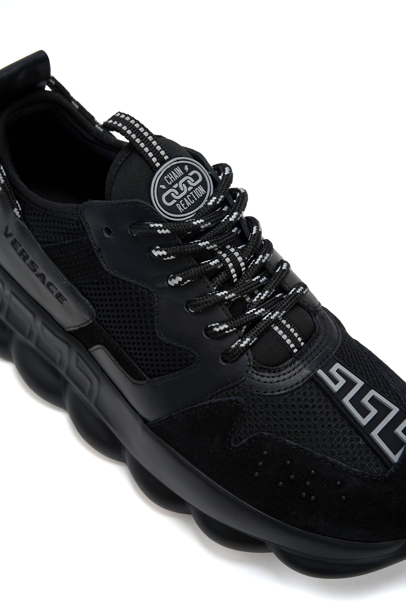 versace Black sneaker with brand logo on a white background