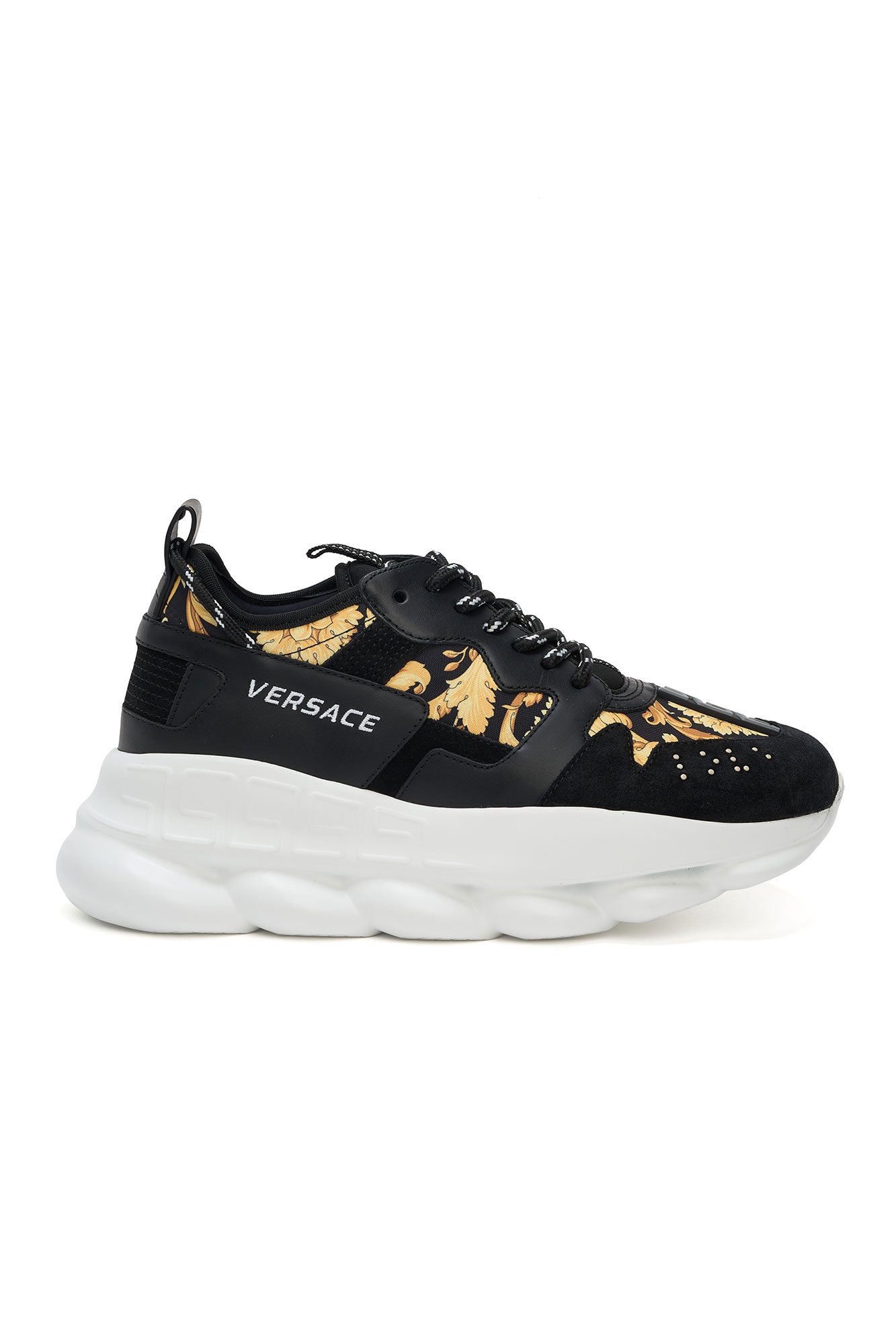 Black Versace sneaker with gold designs on a white background